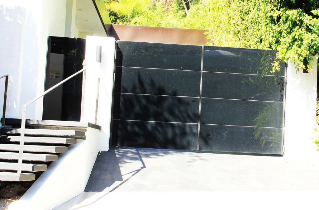 Contemporary black glass bifold auto gate